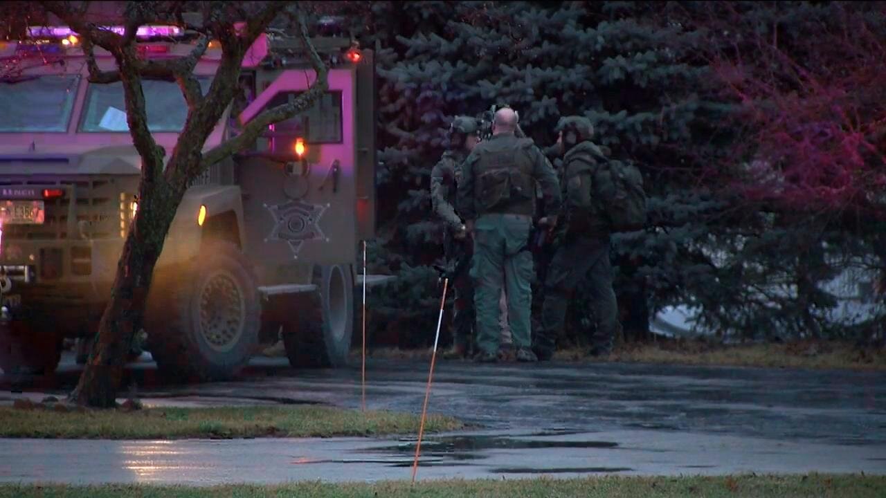 Next door neighbor describes witnessing standoff from inside her home