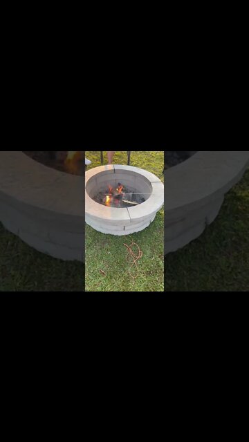 Cooking hotdogs over a fire