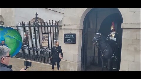 extinction rebellion protester dressed as planet earth scares the Horse #horseguardsparade