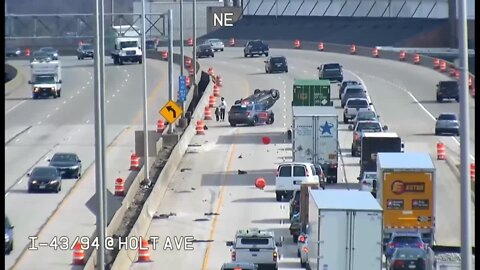 WATCH: Car crashes, flips with child, AK-47 inside; suspect runs across freeway