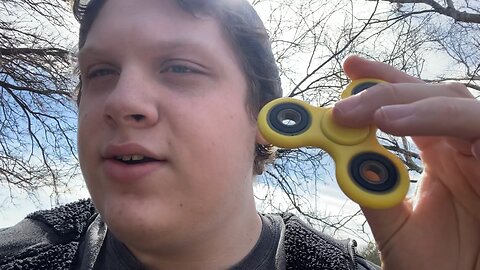 Me in outside with my fidget spinners - spring time