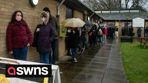 Footage shows queues outside a vaccination centre as bookings for booster open to over 30s