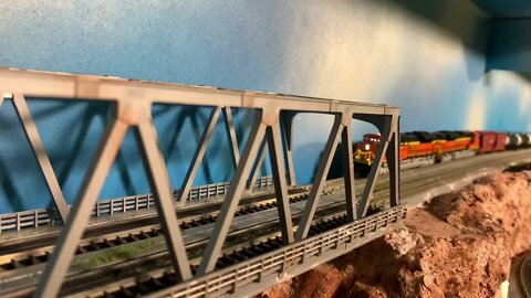 N Scale tanker train pulling away from helpers