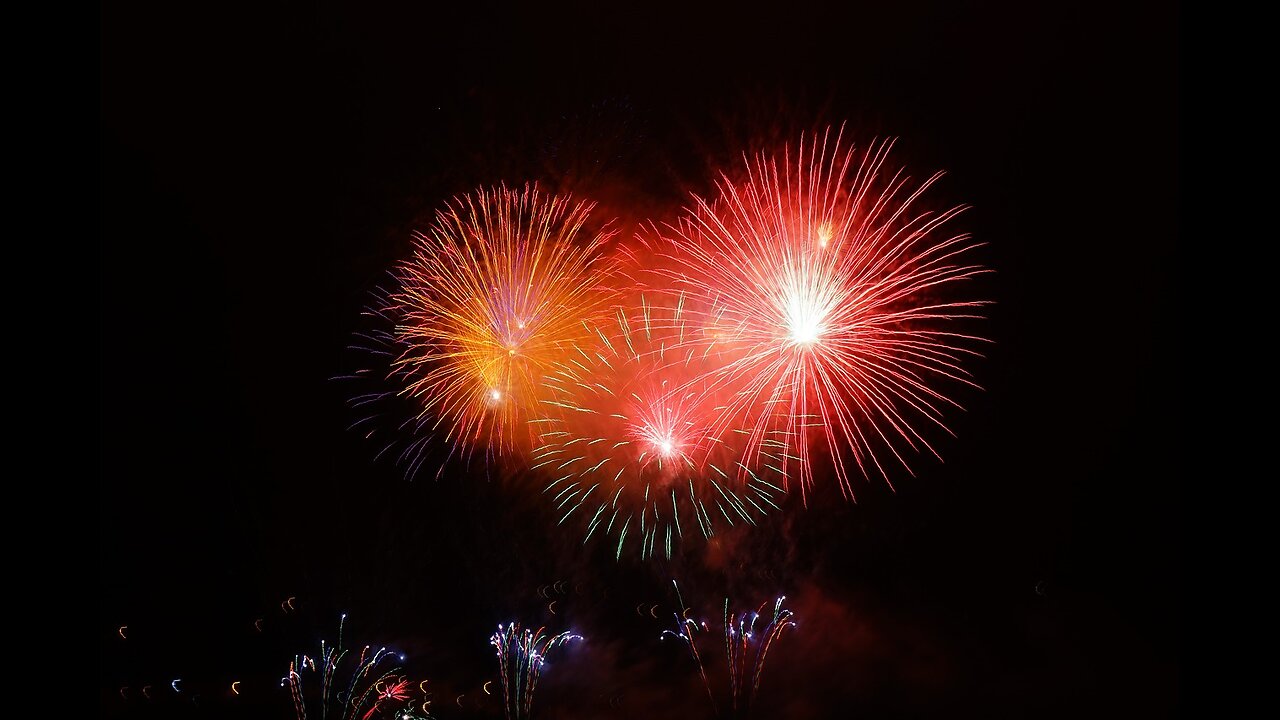 Colorful Fireworks Exploding in Night Sky