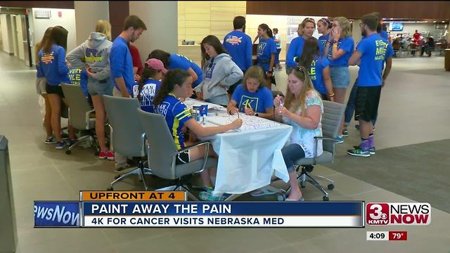 Runners stop cross country trek to paint with cancer patients, caregivers