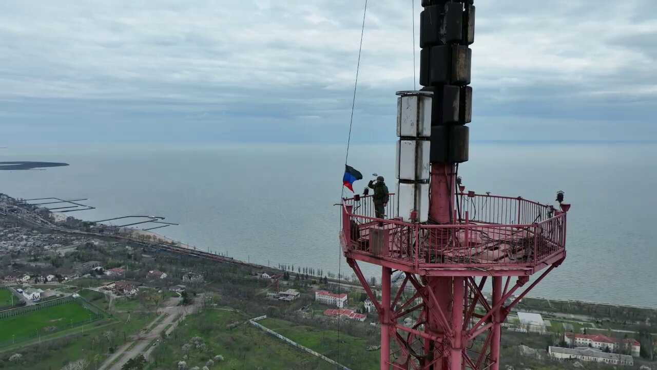 The flag of the Donetsk People's Republic was raised on a TV tower in Mariupol, the highest point in the city