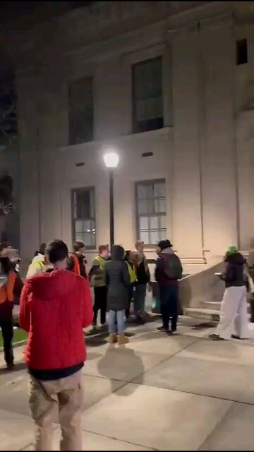 Antisemitic students make a chain blocking Jewish Professor from entering the school grounds.
