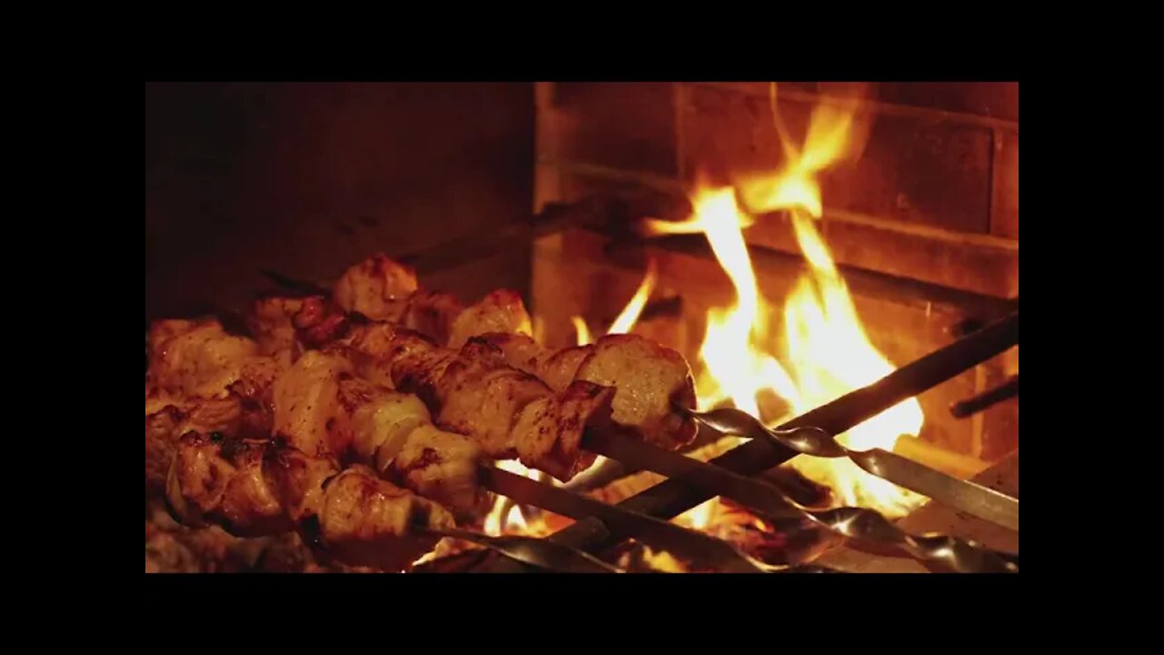 Meat skewers grilling on a grill