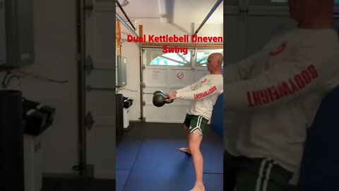 Dual Kettlebell Uneven Swings