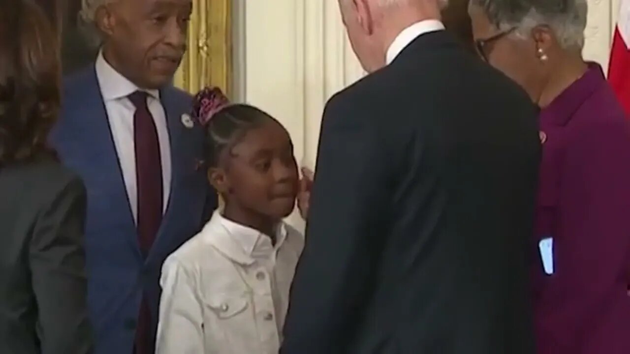 Biden acting creepy around children again