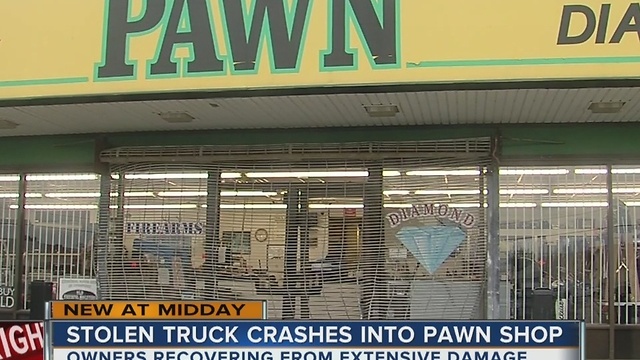 Man crashes stolen truck into pawn shop