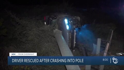 Fallen pole leaves man trapped after car crash on I-805 near Torrey Pines