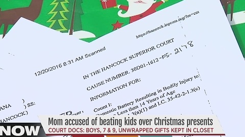 Greenwood police say a mother hit her 7 and 9-year-old sons because they opened Christmas presents