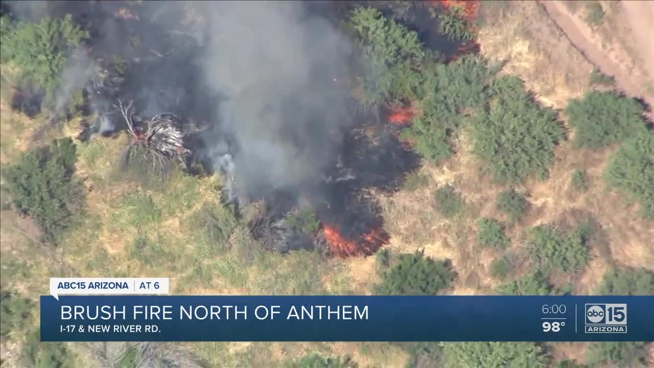 Firefighters battle brush fire near Interstate 17 and New River Road