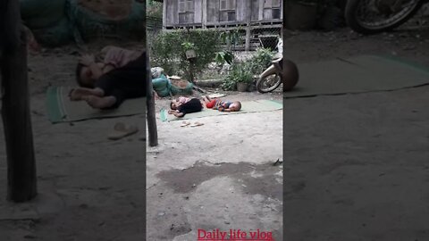 oh my god two kids lying in the yard