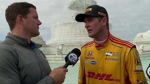 Ryan Hunter-Reay joins Brad Galli and Justin Rose in the Detroit Grand Prix winner's circle