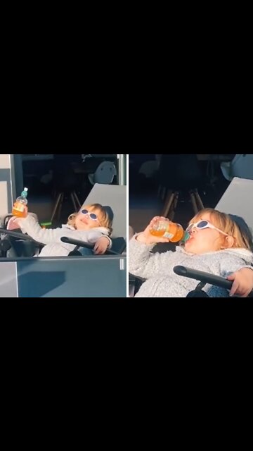 Cool kid lives her best life drinking juice in the sun