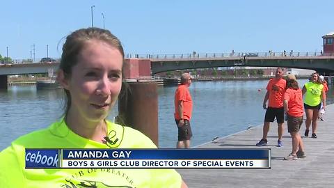 Dragon boats glide down the Fox River