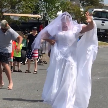 Group Of Men Race In High Heels During Bachelor Party