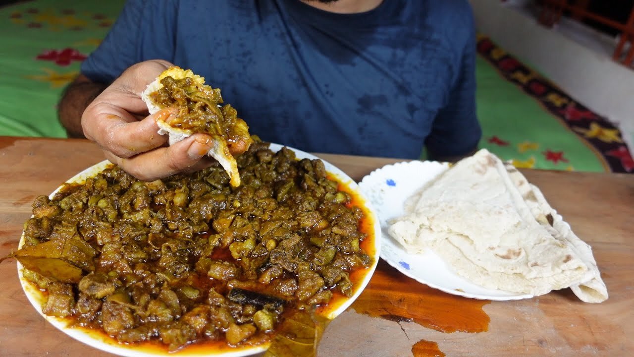 EATING SPICY MUTTON BOTI AND ROTI