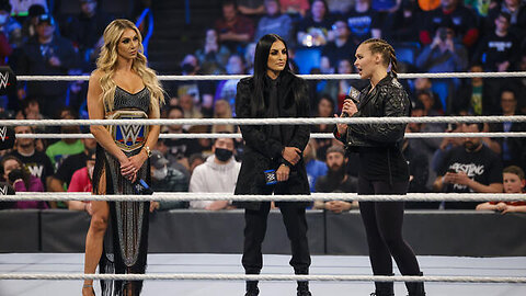 Ronda Rousey storms into SmackDown and challenges Charlotte Flair at WrestleMania @WWE