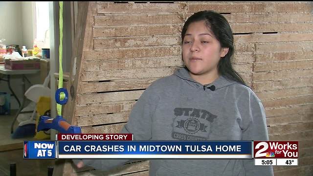 Car crashes into home just inches from children