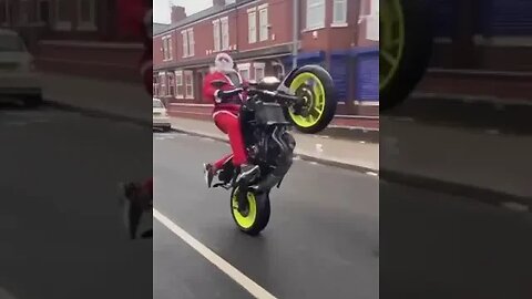 SANTA DOING WHEELIE