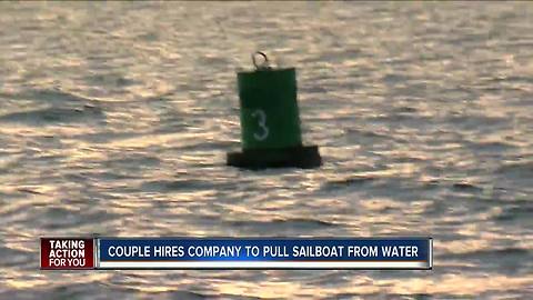 Couple hires company to pull sailboat from water