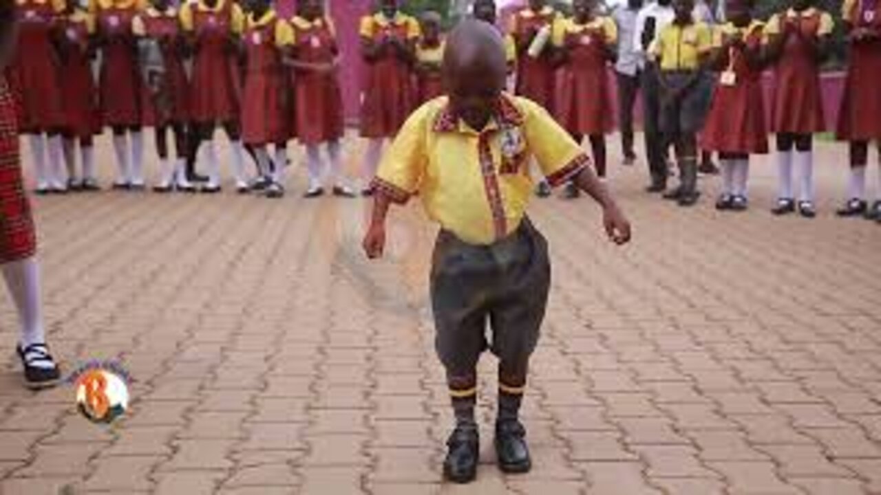 Sam Bright Muhindo entertains the school on his first day