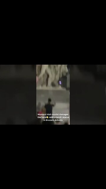 Moment Irish tourist damages 'the hand✋ with a torch' statue in Brussels #shorts #moment #irish