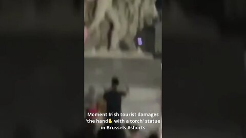 Moment Irish tourist damages 'the hand✋ with a torch' statue in Brussels #shorts #moment #irish