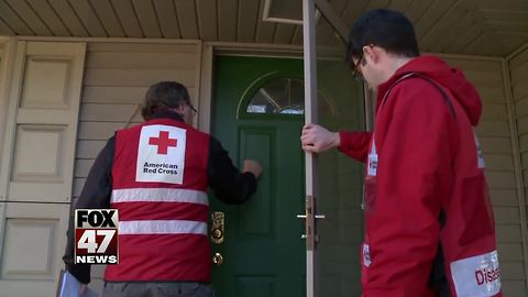 Red Cross going door to door with items for those affected by the floods