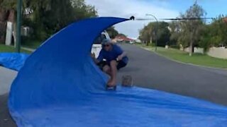 Surfers get barreled on the street