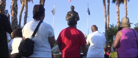 Protesters gather at Martin Luther King Jr. statue