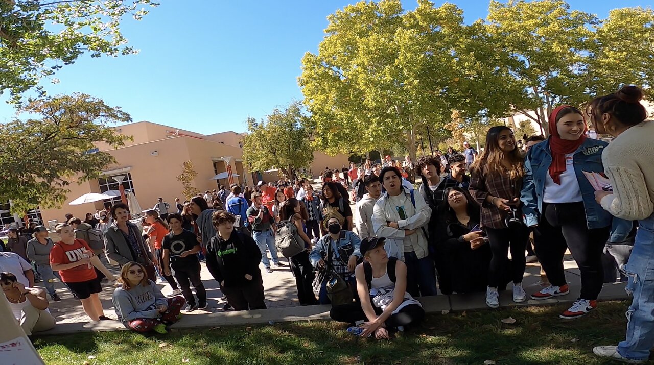 Univ of New Mexico: Biggest Crowd Ever, Demon-Possessed Student Tries to Wrench My Banner From Me, He Gets Tackled to the Ground, Extremely Hostile Crowd, But Jesus is Exalted & Another Campus Christian Ministry Prays For Me and Helps Me Minister