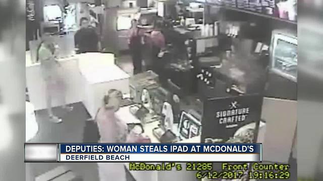 Woman Sreals IPad at McDonald's