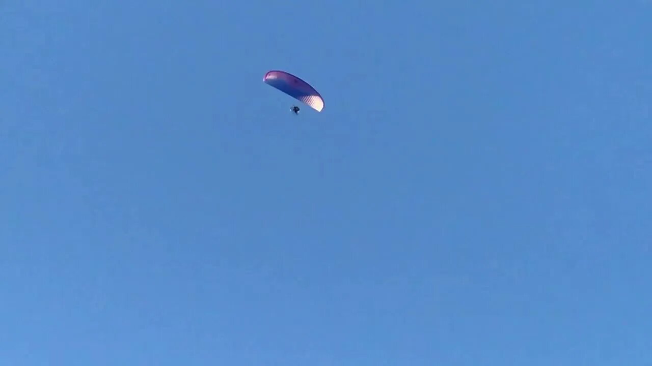 Paraglider flying over the Lucky Garden Chinese restaurant in McGehee