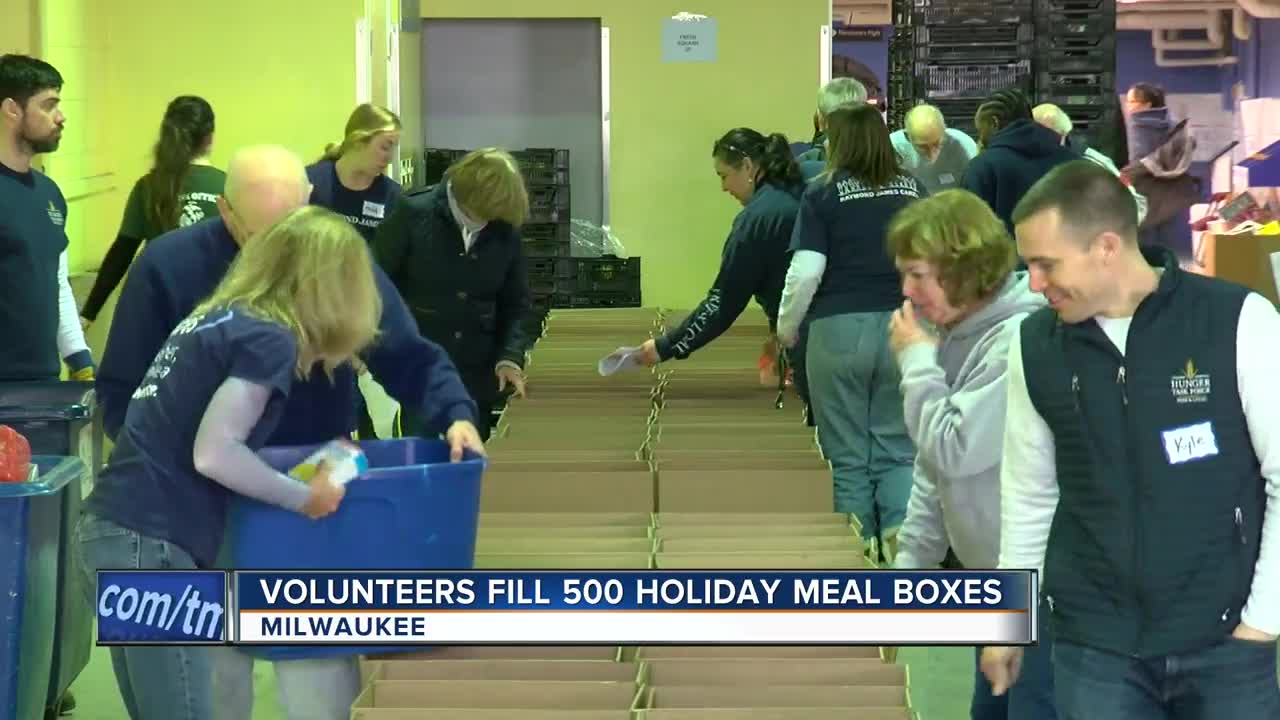 50 volunteers fill 500 holiday meal boxes for families in need