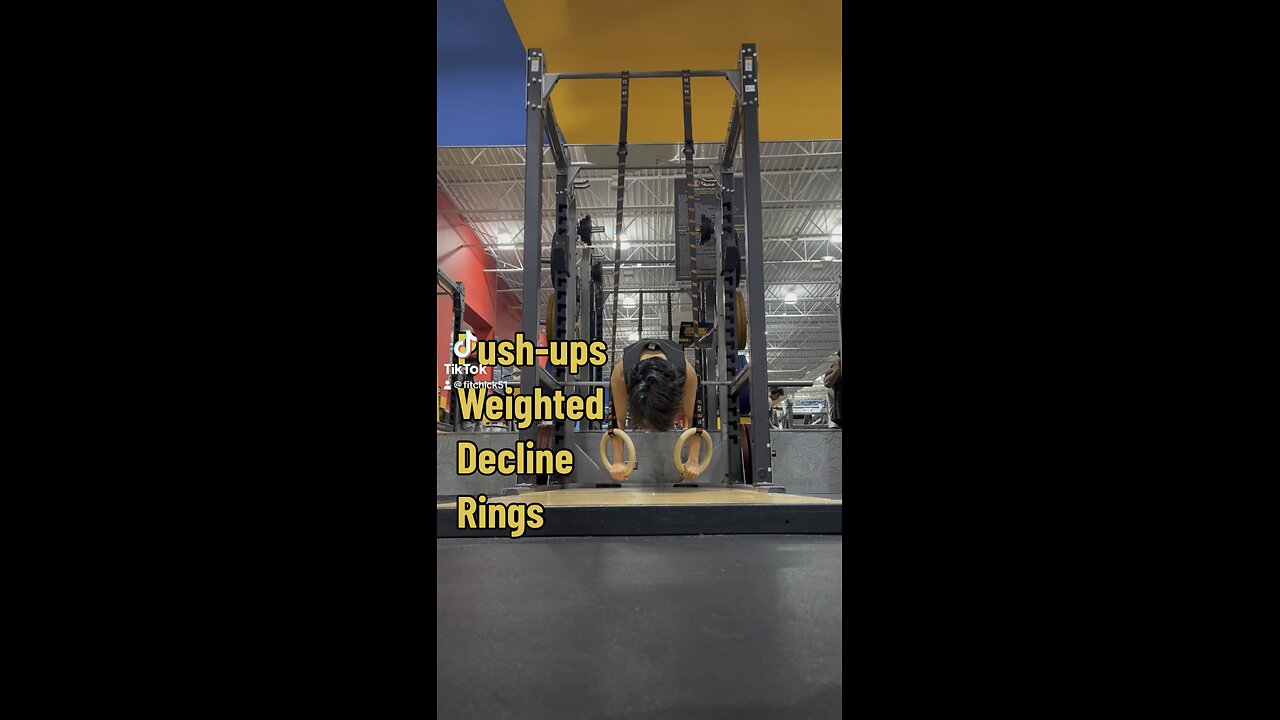 Ring push-ups with weight vest and decline