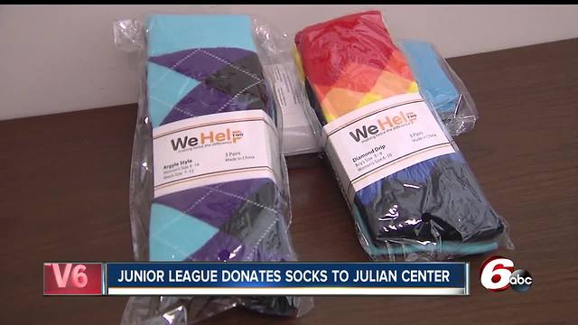 Junior League donates hundreds of pairs of socks to the Julian Center