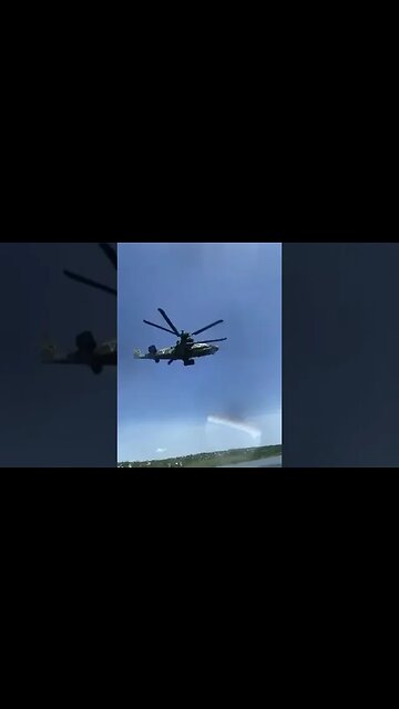 Russians flying Ka-52 entertain people on the beach in Alchevsk.