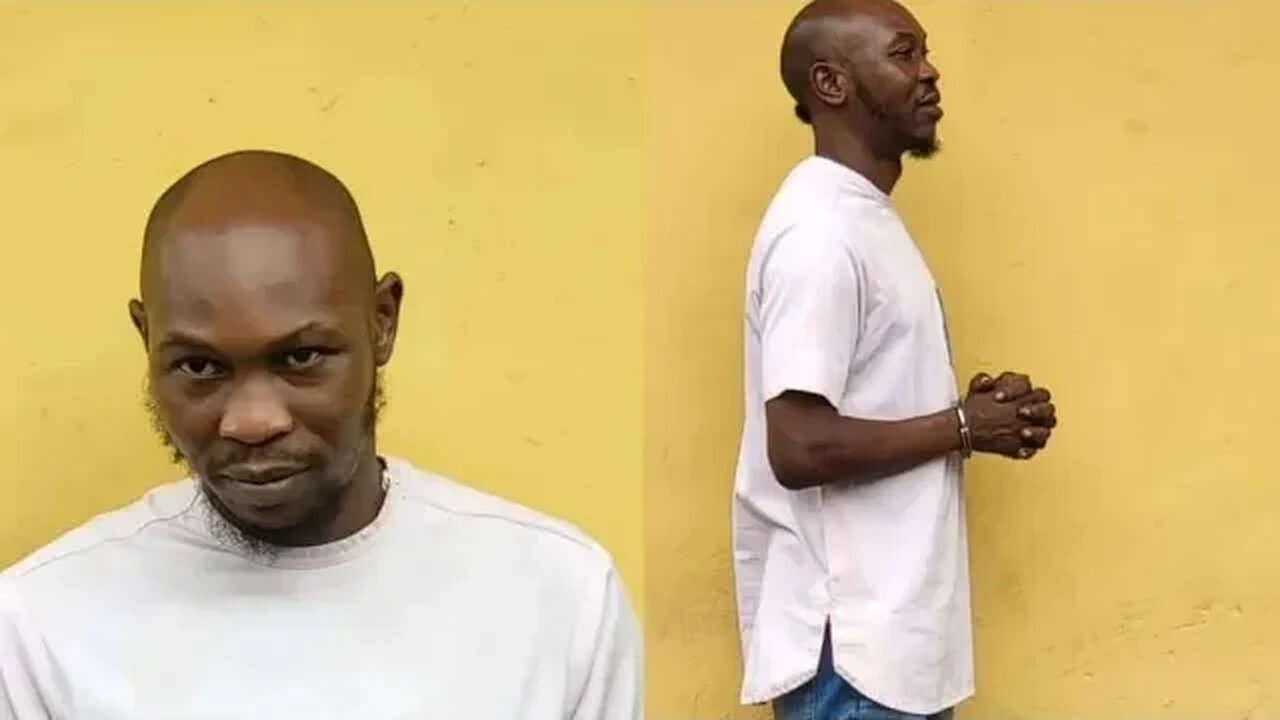 Seun Kuti handcuffed and taken into custody after submitting himself to the police authority.