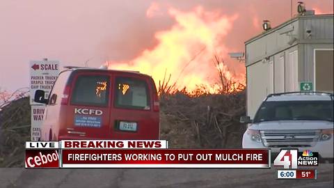Smoke fills the sky in large mulch fire