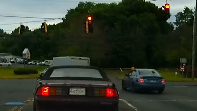 Speeds up to run red light