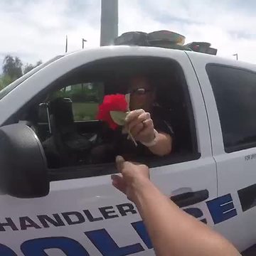 Motorcyclist gives Chandler officer a flower