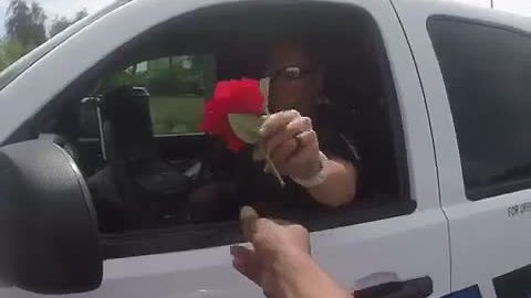 Motorcyclist gives Chandler officer a flower