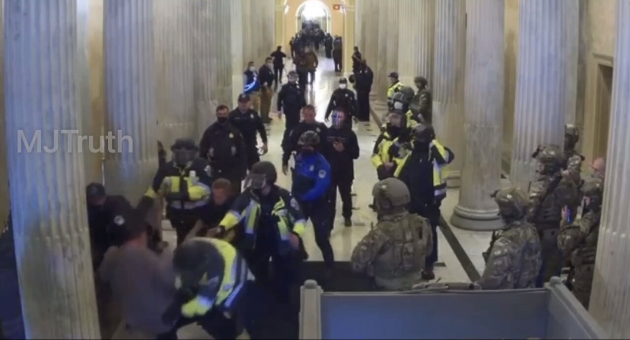 Jan. 6 protester wants to leave but police slam him into a pillar and is left on the floor