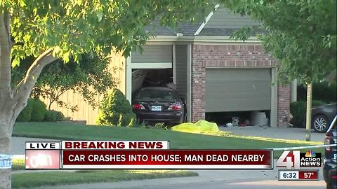 Car into house, man dead outside in north KCMO