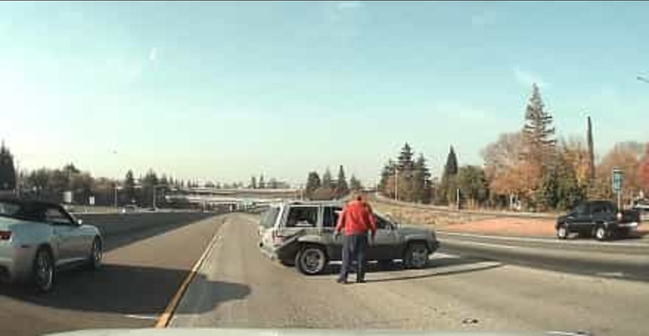 Out of control jeep reverses across the highway