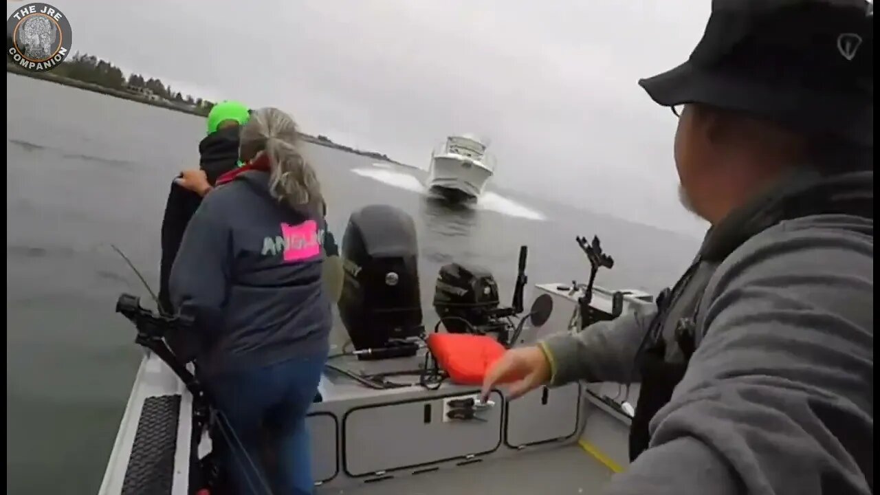 Fishermen jump off boat at last second to avoid oncoming speed boat.